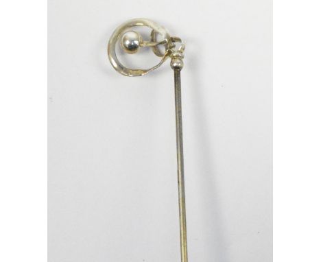 A Charles Horner sterling silver hat pin of scrolling form centred with a ball, head width 1.75cm, ball mounted on a 15cm pin