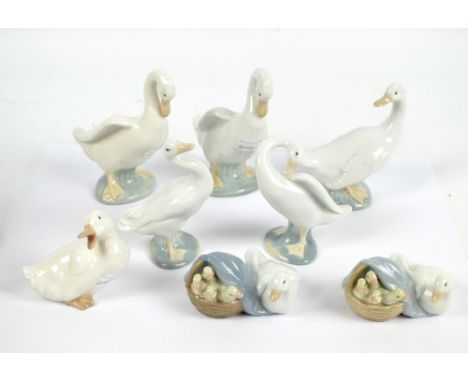 Four Nao figures of geese, two similar Lladro examples and two figure groups of geese with ducklings (8).
