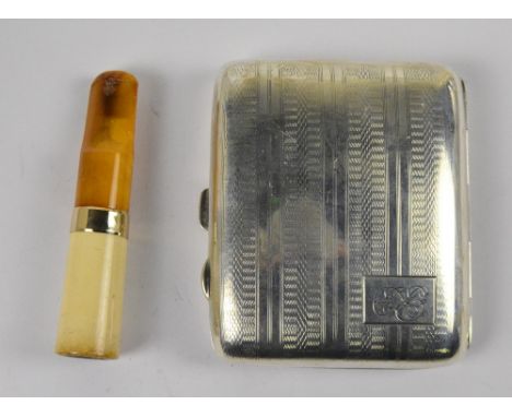 A George V hallmarked silver rounded rectangular overall engine turned decorated cigarette case with rectangular cartouche in