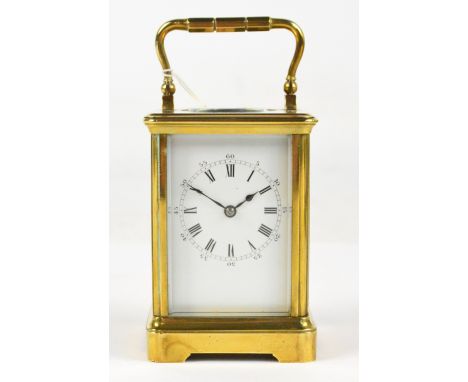 A late 19th century French brass cased petit zero carriage clock by Drocourt, with swing loop handle above white enamel dial 
