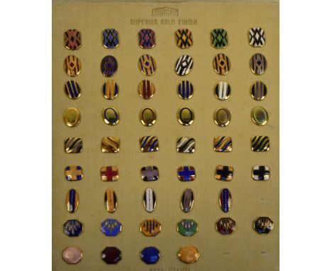 A Charles Horner Dorcas sample sheet of enamel and gold-plated cufflink fronts including hexagonal examples, oval examples, r