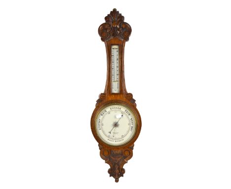 An early 20th century oak aneroid wheel barometer, the white enamel dial inscribed "Morath Bros. Liverpool", height 90cm.