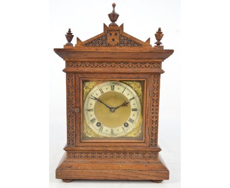 An Edwardian oak cased eight day mantel clock, height 36cm.