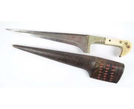 A late 19th century Indian dagger with ivory mounted handle, shaped engraved mounts and tapering blade, in stitched and decor