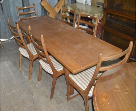 A 20th century teak rectangular refectory table, 190 x 71cm and a set of six ladder back chairs.