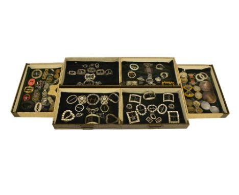 A large collection of buckles including an early 18th century man's shoe buckle set with mother of pearl panels, many example