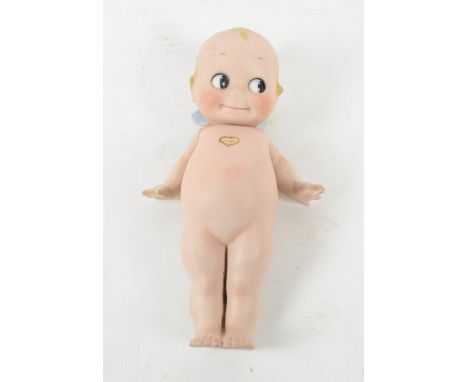 A Kewpie bisque full baby doll.