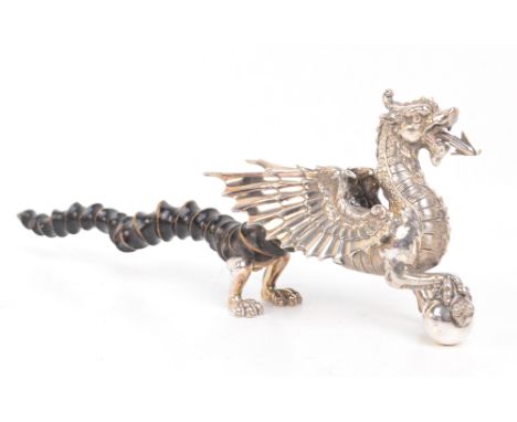 WALKER & HALL; a late Victorian electroplated novelty table lighter modelled as a dragon of Wentley with a black buck horn ta