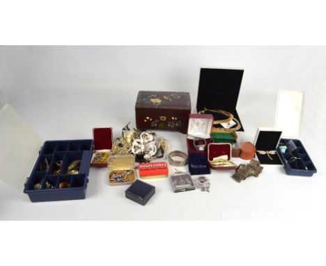 A large collection of costume jewellery comprising various brooches  to include hallmarked silver examples and a boxed Swarov