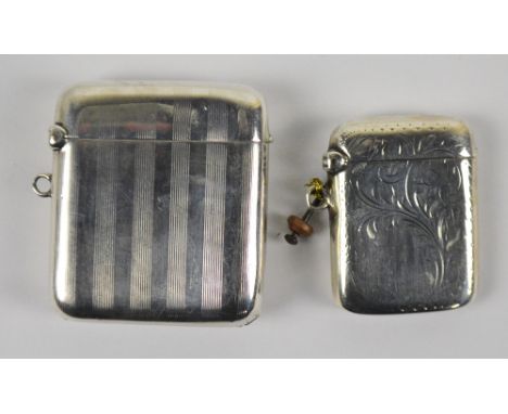 A George V hallmarked silver vesta case of rectangular form with engraved foliate scroll decoration, Joseph Gloster Ltd, Birm