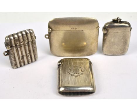 Four variously hallmarked silver vesta cases to include an overall engine turned decorated example centred with a crested car