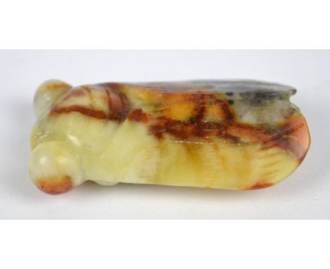 A carved mottled jade model of a cicada, length 5.5cm.