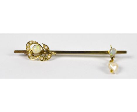 An Edwardian 9ct yellow gold opal and pearl bar brooch/tie pin with Art Nouveau stylised floral decoration to one side and na