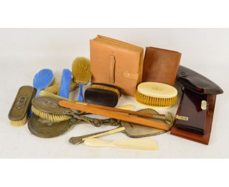 A large collection of dressing table items including two three piece mirror and brush sets, two gentleman's brush sets, tie p