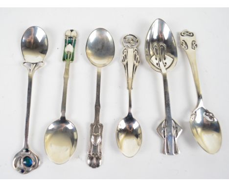 Six modern reproduction white metal tea spoons, modelled as Arts and Crafts originals, two with enamel decoration, various st