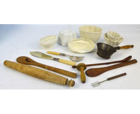 A collection of kitchenalia including ceramic jelly moulds, rolling pin, sieve, spoons, etc. CONDITION REPORT: .