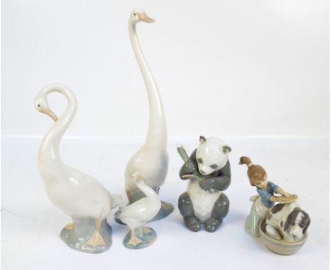 Three Nao figures of geese and panda bear eating bamboo, a Lladro figure group of girl brushing a dog and a goose (5).