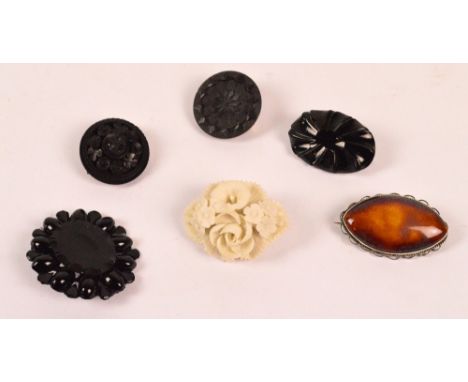 A Ruskin ceramic graduated amber coloured glazed navette shaped brooch in silver mounts, width 4.5cm, a WH Goss floral exampl