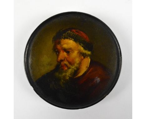 A 19th century papier mâché circular snuff box with hand painted cover decorated with a bearded man, diameter 9.2cm.