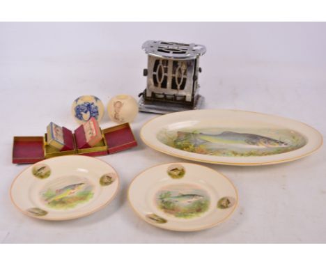 A ceramic match striker with transfer decoration, Taylor, Tunnicliffe & Co, and a further example inscribed "Electricity", al