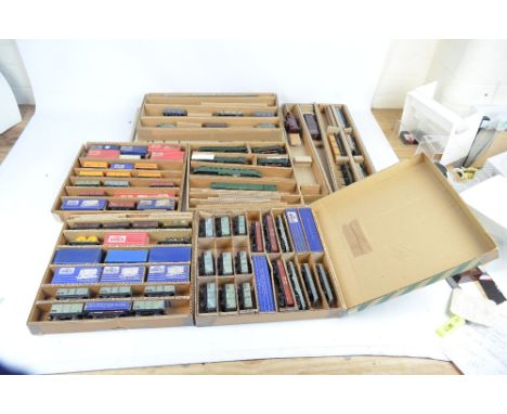 A collection of unboxed tankers and wagons, including Esso, Mobile and Shell.