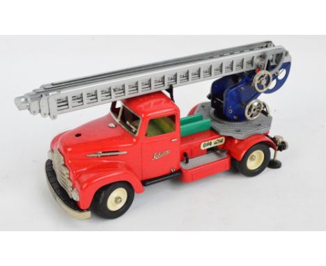 A 1950s/60s playworn tinplate Schuco electro construction fire engine no.6080 with "Take-Apart" feature with remote steering 