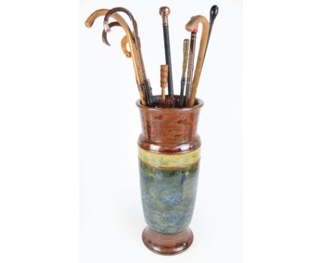 A large Doulton stoneware stick stand of tapering form decorated in mottled shades of green and brown together with a small s