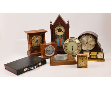 A group of various mantel clocks to include an early 20th century American example, height 41cm, a brown onyx rectangular exa