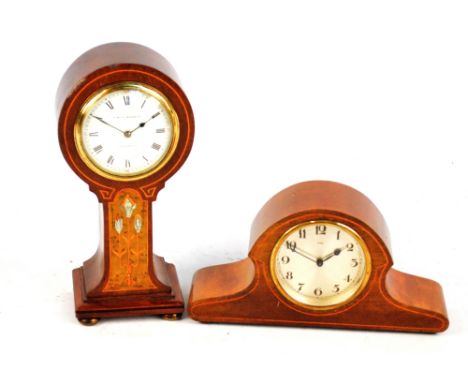 An Edwardian mahogany and inlaid balloon shaped mantel timepiece with circular white enamel dial inscribed "W.Batty & Sons Lt