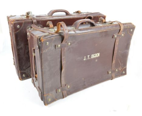 A pair of large modern leather suitcase with expanding tops, leather straps and handles, inscribed JT Ogden, stamped for the 