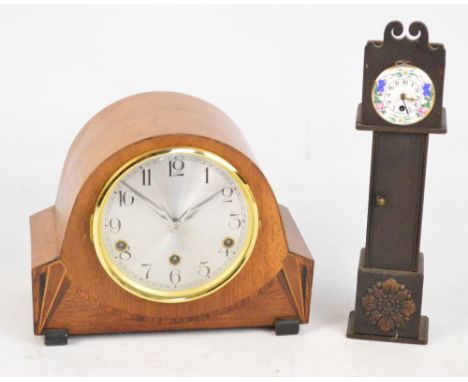 A 1940s walnut eight day mantel clock with silvered dial set with Arabic numerals, width 28cm and a miniature longcase clock,