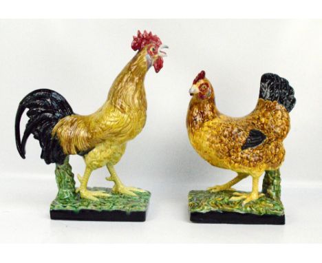 A pair of large Portuguese ceramic figures of a cockerel and hen, on rectangular realistic base, height 47.5cm and 38cm. COND