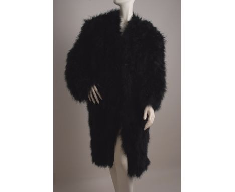ANDRE LAUG BLACK WITH SPLASHES OF RED FEATHER COAT. A feather coat model number 8854. The coat is made from black chicken fea