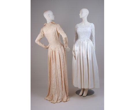 TWO 1950's WEDDING DRESSES To include a cream floral damask full length dress with high neck, small button detail down the ba