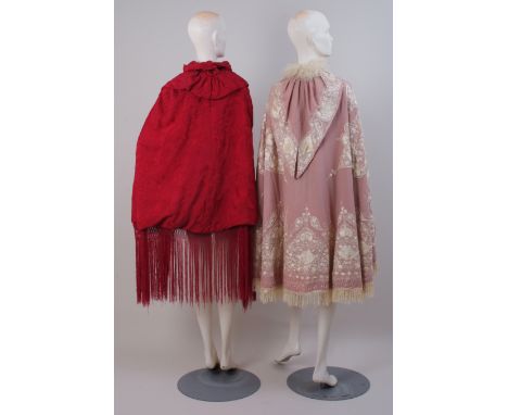 TWO 19TH CENTURY OPERA CLOAKS An Early 19th Century Kashmir pink wool embroidered cloak, lined in satin with a lambs fur coll