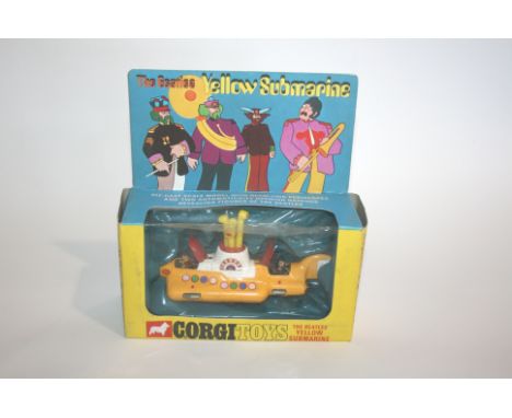 CORGI TOYS - BEATLES YELLOW SUBMARINE Model Number 803 with two red hatch covers, the plastic window slightly dented.