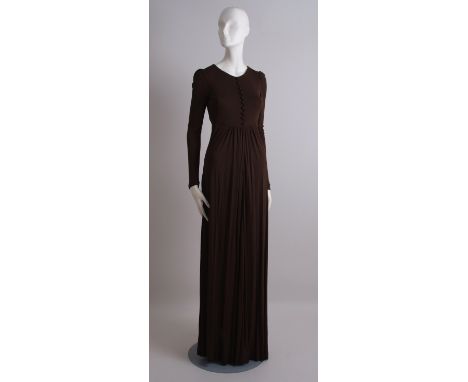 1970's GINA FRATINI JERSEY DRESS. This elegant and feminine dress has been made from a heavy jersey rayon.  The dress is simp