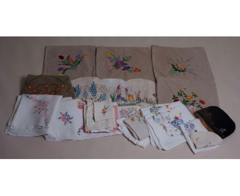 A COLLECTION OF EMBROIDERED CUSHION COVERS & LINEN A large bag of beautifully hand embroidered linen, with a group of four cu