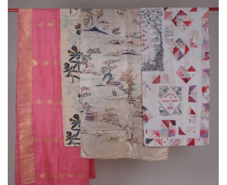 A SILK EMBROIDERED WALL HANGING & PATCHWORK. An embroidery on silk wall hanging, a quilted patchwork with religious pros. A s