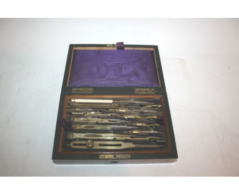 CASED GEOMETRY SET a rosewood cased set, the top tray fully fitted and with rulers etc underneath. Case 21cms across