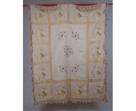 A SUITCASE OF VICTORIAN LACE, BED THROW & TABLE CLOTHS A patchwork of flowers, crewel worked on a cream linen ground, laced t