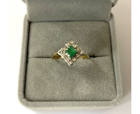 An 18ct gold emerald and diamond ring, Size P, (A)