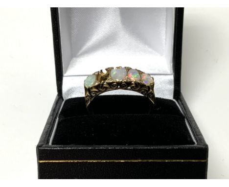 An 18ct gold opal and diamond ring, full hallmarked Size P. (1 opal missing)