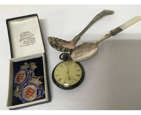 A collection of silver and enamel Essex Cricket League medals a silver cased watch and plated cutlery. ( a lot)