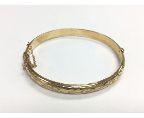 A 9ct gold bangle, approx 8.2g. Shipping category A.