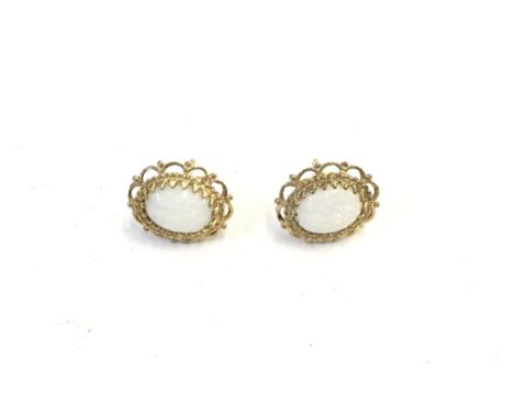 A pair of 9ct gold earrings inset with opal. 1.64g Postage A- NO RESERVE