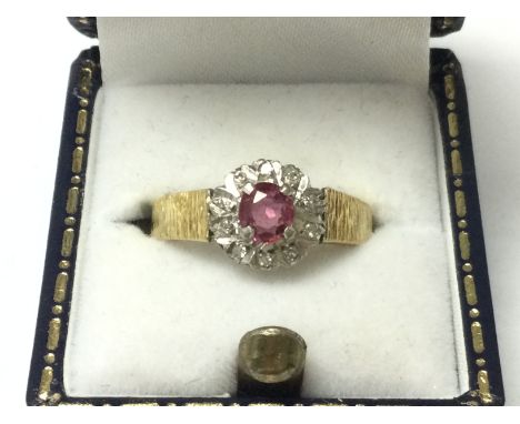 An 18ct gold ruby and diamond ring, size M 3.5g postage category A