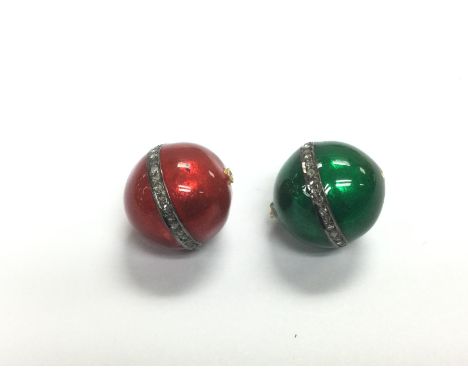 A pair of enamel and diamond beads in red and green. R/C diamonds approx 0.30ct. Shipping category A.