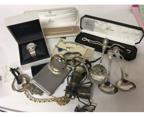 A silver gilt bangle a quantity of watches dress jewellery and elaborate spoons. (a lot)