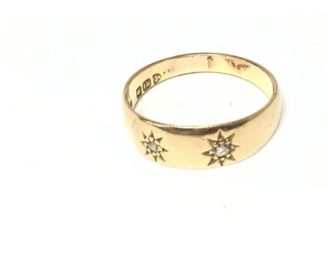 An 18ct gold ring set wit( two small diamonds. Size R 1/2 and 4.56g Postage A